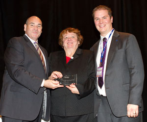 Marion Fraser receiving the 2010 Community Power Leader Award, November 15. Left to right: George Smitherman, former Minister of Energy and Infrastructure; Marion Fraser, Fraser & Company; and Kristopher Stevens, Executive Director of the Ontario Sustainable Energy Association. Photo by Lori-anne Stewart, Pearl Street Communications.